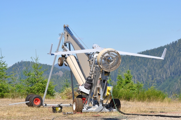 ScanEagle prepares to launch during a wildfire
