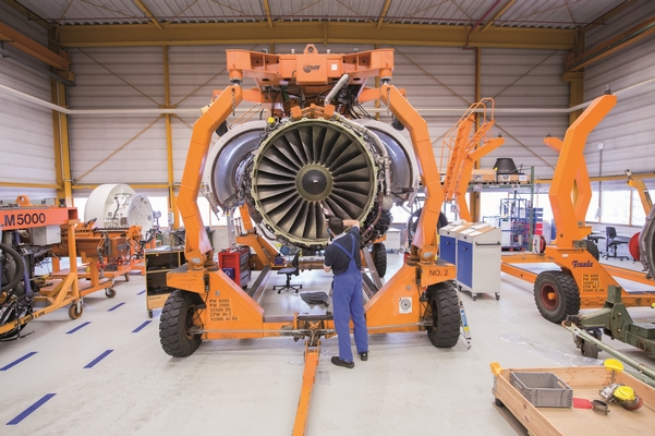 A CFM56 engine undergoes maintenance in a shop