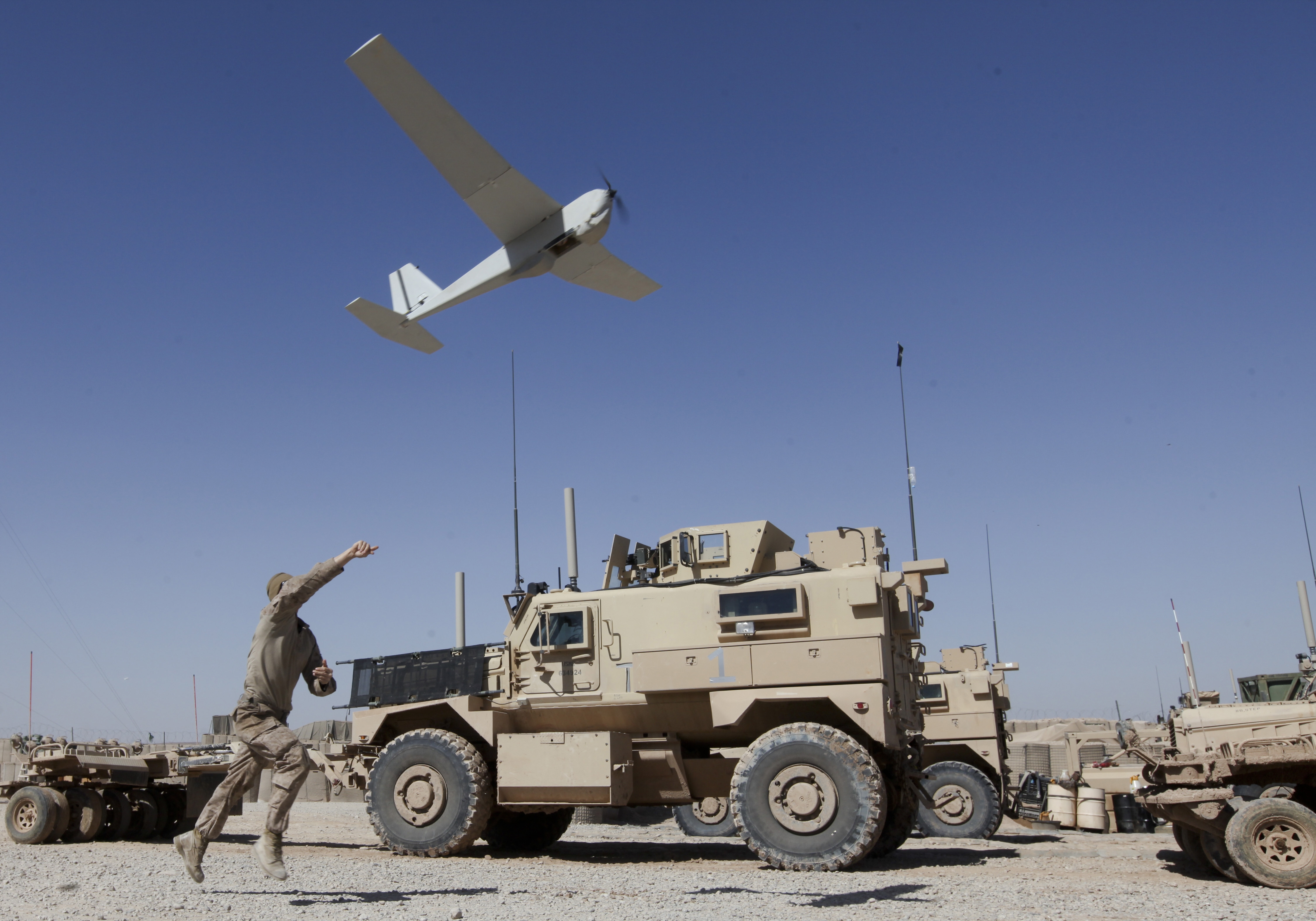 A Marine launches a UAV in Afghanistan.