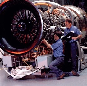 Workers prepare a PWPS turbine for shipment.