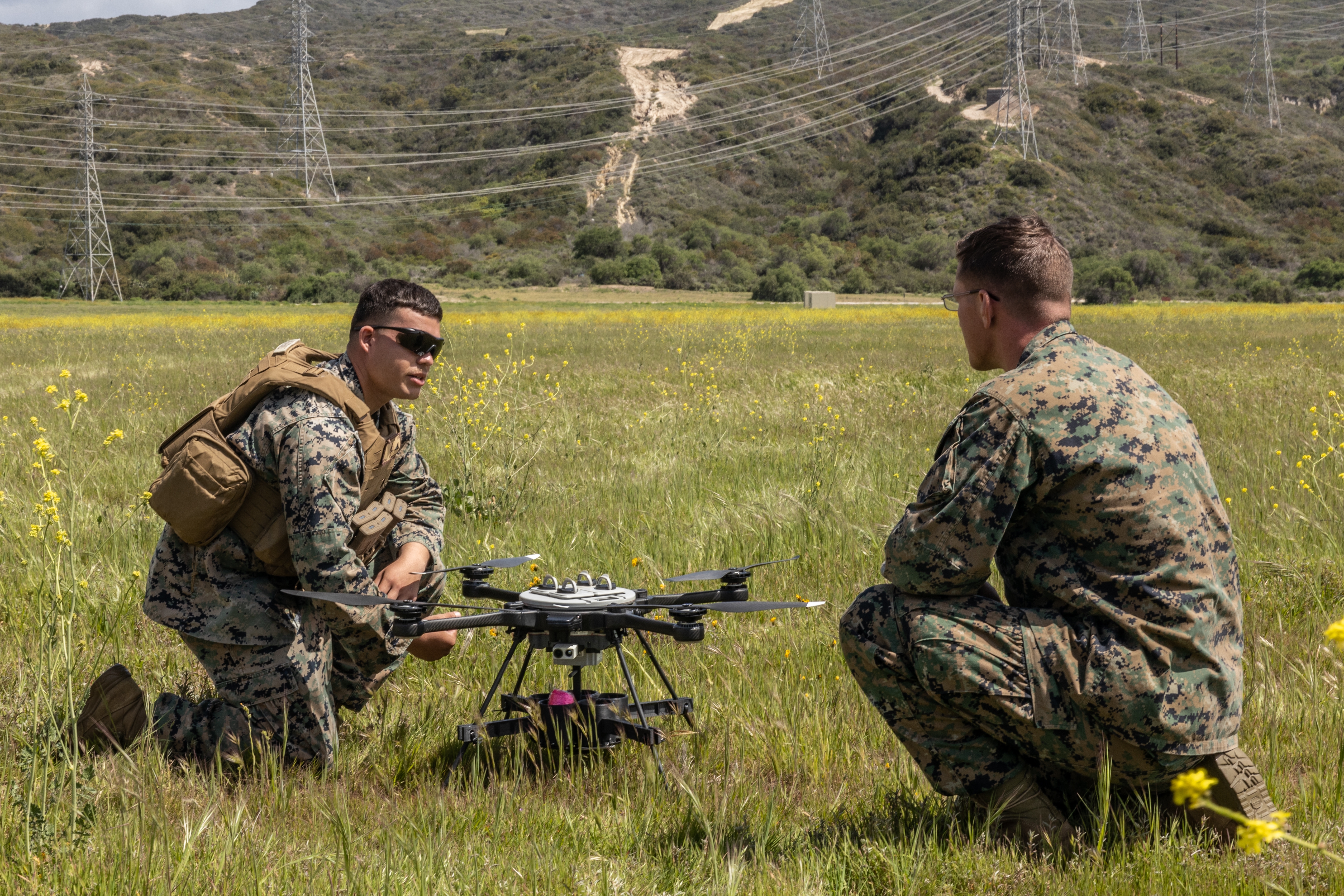 Marines work with a small unmanned aerial system