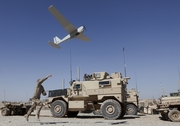 A Marine launches a UAV in Afghanistan.